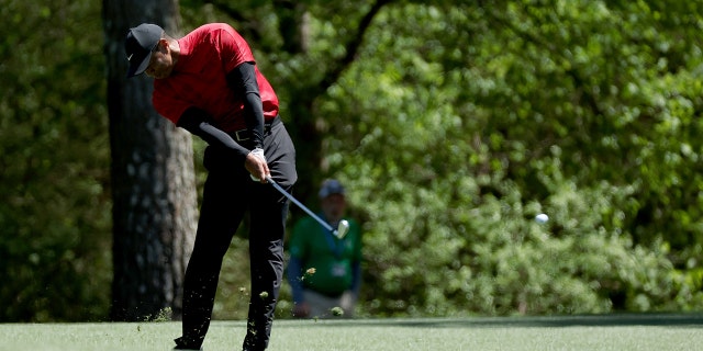 Tiger Woods plays his shot on the 11th hole during the final round of the Masters on April 10, 2022, in Augusta, Georgia.