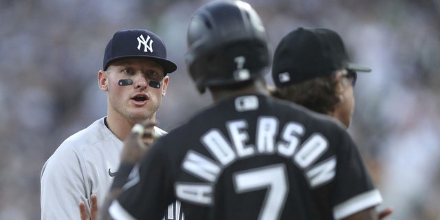 New York Yankees third baseman Josh Donaldson and White Sox baserunner Tim Anderson exchange words at Guaranteed Rate Field on May 13, 2022 in Chicago.