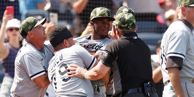Tim Anderson of the Chicago White Sox is held back after a bench-clearing dispute at Yankee Stadium on May 21, 2022 in the Bronx.