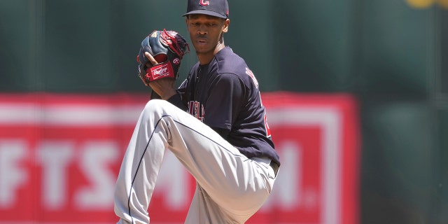 Cleveland Guardians starting pitcher Triston McKenzie ends up throwing against the Oakland Athletics during the first round of a baseball game in Oakland, California, on Sunday, May 1, 2022.