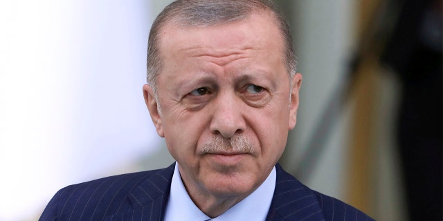 Turkish President Recep Tayyip Erdogan arrives for a welcoming ceremony for his Algerian counterpart, Abdelmadjid Tebboune, in Ankara, Turkey, on May 16, 2022.