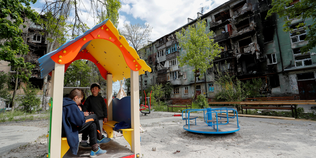 Children gather at a playground in Mariupol, Ukraine, on Thursday, May 11.