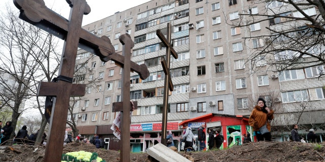 FILE PHOTO: A view shows graves of civilians killed during Ukraine-Russia conflict in the southern port city of Mariupol, Ukraine April 19, 2022. 