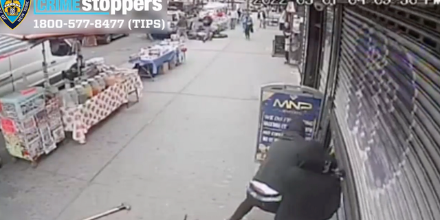 The New York Police Department released a video showing a person in a black shirt, ski mask, and white shoes approaching a jewelry store on Sunday and repeatedly smashing a sledgehammer into the window.