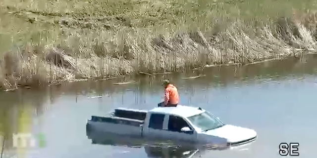 A man in Minnesota was rescued after being stuck on the top of his pickup truck which went into a pond in Lakeville.
