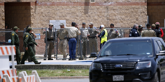 Law enforcement and other first responders gathered outside Robb Elementary School after a shooting in Uvalde, Texas, on Tuesday, May 24, 2022.