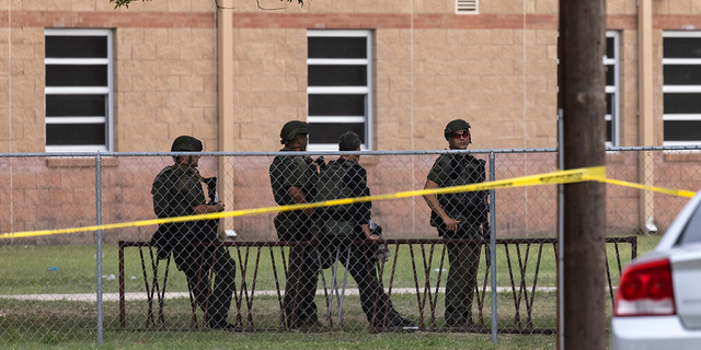 Law enforcement work the scene after a mass shooting at Robb Elementary School in Uvalde, Texas, on Tuesday, May 25.