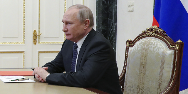 Russian President Vladimir Putin chairs a meeting with members of the Security Council via a video conference at the Kremlin in Moscow, Russia, on April 29.