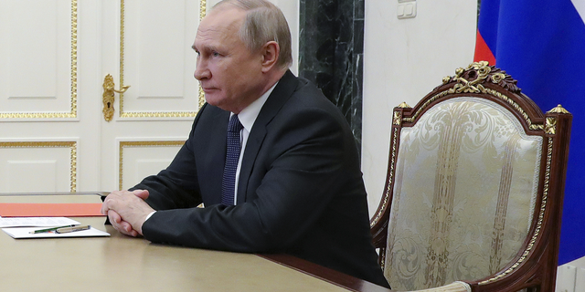 Russian President Vladimir Putin chairs a meeting with members of the Security Council via a video conference at the Kremlin in Moscow on April 29.