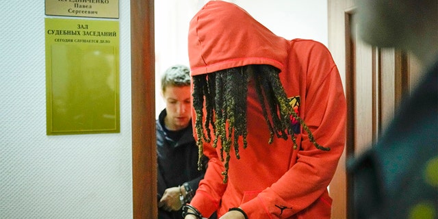 WNBA star Brittney Griner leaves a courtroom after a hearing in Khimki, just outside Moscow, Russia, May 13, 2022.