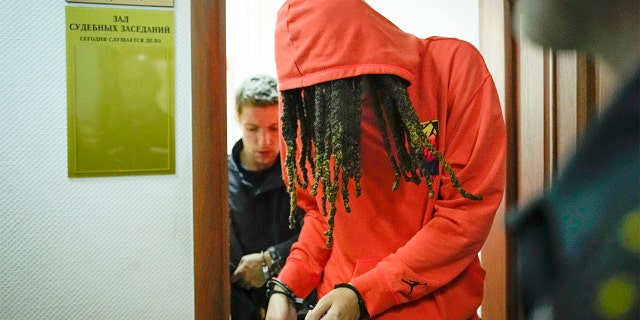 WNBA star and two-time Olympic gold medalist Brittney Griner leaves a courtroom after a hearing in Khimki just outside Moscow, Russia May 13, 2022.