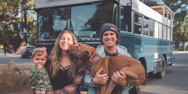 Will and Kristin Watson have been traveling in their renovated bus with their 3-year-old daughter Roam and their 10-year-old pit bull Rush since April 2019. 
