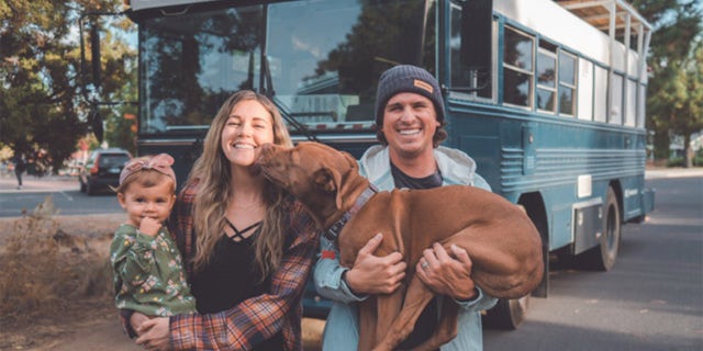 Will and Kristin Watson have been traveling in their renovated bus with their 3-year-old daughter Roam and their 10-year-old pit bull Rush since April 2019. 