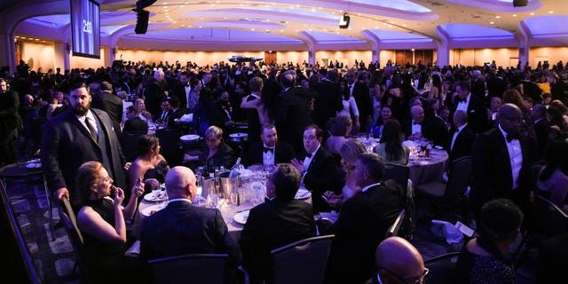 Guests mingle during the annual White House Correspondents Association Dinner in Washington, D.C., April 30, 2022.
