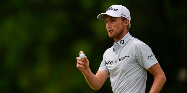 Will Zalatoris salutes after puttingt on the eighth hole during the final round of the PGA Championship golf tournament at Southern Hills Country Club on Sunday, May 22, 2022, in Tulsa, Oklahoma.