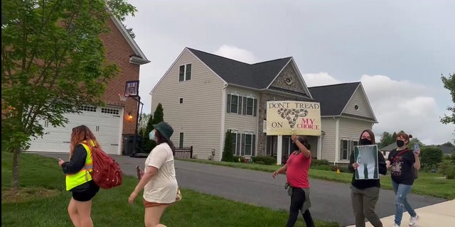 Protesters near the home of Justice Amy Coney Barrett.