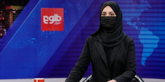 Khatereh Ahmadi, a TV anchor, wearing a face covering as she read the news on TOLO NEWS, in Kabul, Afghanistan, May 22, 2022.