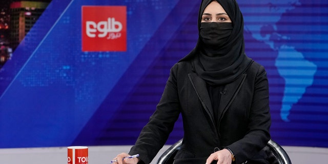 Khatereh Ahmadi, a TV anchor, wearing a face covering as she read the news on TOLO NEWS, in Kabul, Afghanistan, May 22, 2022.