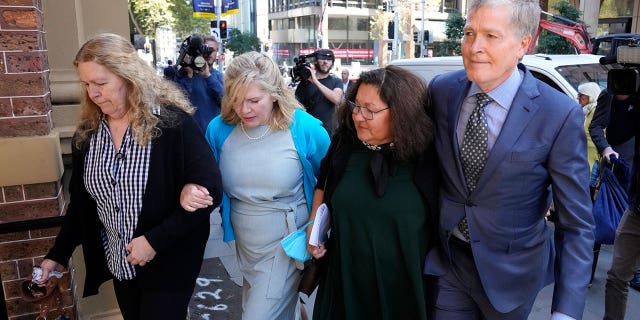 The family of Scott Johnson, brother Steve Johnson and, left to right, sisters Terry and Rebecca, and Steve's wife, Rosemarie, arrive at the Supreme Court in Sydney, Monday May 2, 2022.