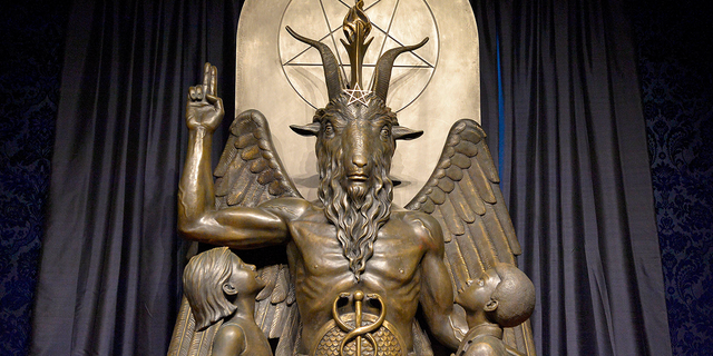 The Baphomet statue is seen in the conversion room at the Satanic Temple where a "Hell House" is being held in Salem, Massachusetts, on Oct. 8, 2019.