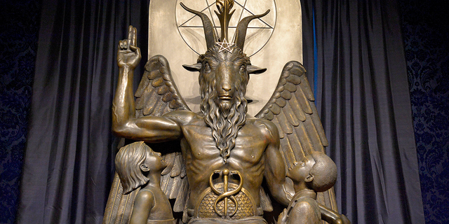 A statue depicting children gazing up at a satanic figure in the conversion room at The Satanic Temple in Salem, Massachusetts, on Oct. 8, 2019.