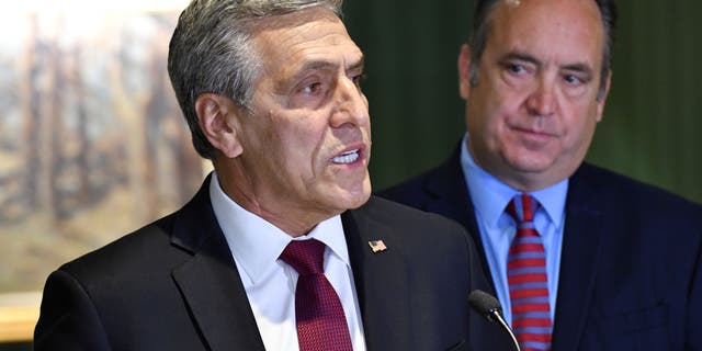 Lou Barletta speaks at a news conference where he accepted the endorsement of a rival in Pennsylvania's crowded Republican primary for governor, Jake Corman, right, May 12, 2022, in Harrisburg, Pa. (AP Photo/Marc Levy)