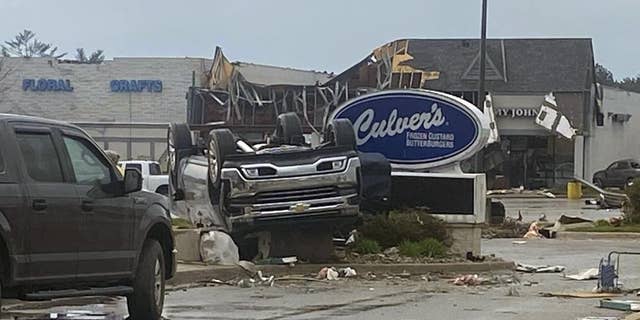 This image provided by Steven Bischer, shows an upended vehicle following an apparent tornado, Friday, May 20, 2022, in Gaylord, Mich.