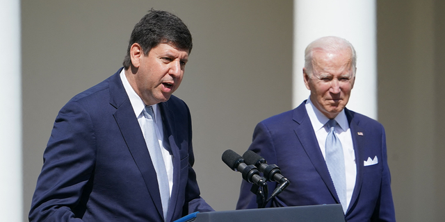 President Biden, right, listens as Steve Dettelbach, nominee for Director of the Bureau of Alcohol, Tobacco, Firearms, and Explosives, speaks on measures to combat gun crime from the Rose Garden of the White House in Washington, D.C., on April 11, 2022.