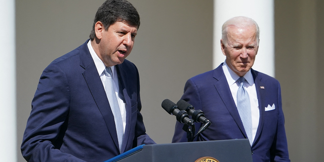 President Biden, right, listens as Steve Dettelbach, nominee for Director of the Bureau of Alcohol, Tobacco, Firearms, and Explosives, speaks on measures to combat gun crime from the Rose Garden of the White House in Washington, D.C., on April 11, 2022.