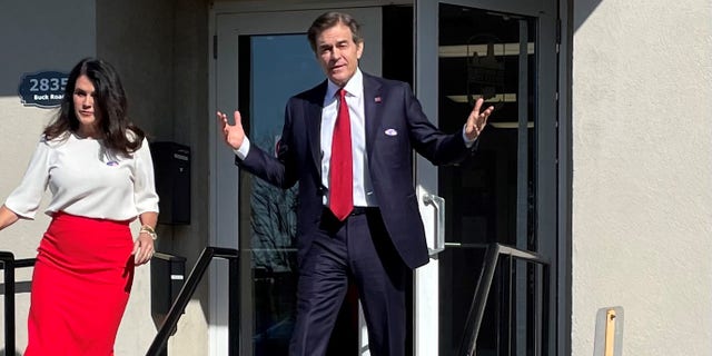 Republican Senate candidate Mehmet Oz greets the media after voting in Pennsylvania's primary, on May 17, 2022, in Bryn Athyn.