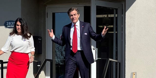 Republican Senate candidate Mehmet Oz greets the media after voting in Pennsylvania's primary, on May 17, 2022, in Bryn Athyn.