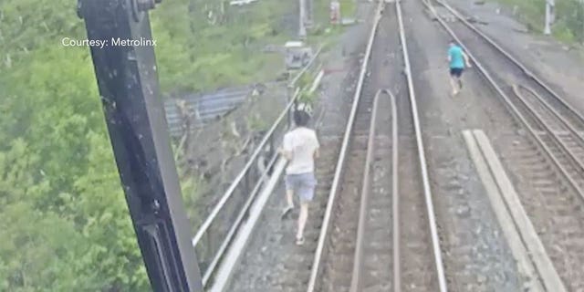 Footage released by Metroinx shows two boys narrowly missing an oncoming train in Toronto, Canada after trespassing on a rail bridge. (Courtesy: Metrolink)