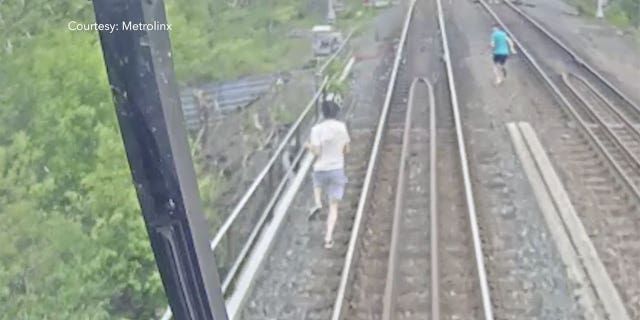 Footage released by Metroinx shows two boys narrowly missing an oncoming train in Toronto, Canada after trespassing on a rail bridge. (Courtesy: Metrolink)