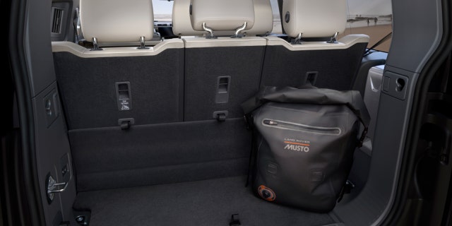 There is 13.7 cubic feet of cargo space behind the Defender 130's rear seat.