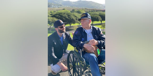 Jack Carr is shown with an American veteran who served in World War II.