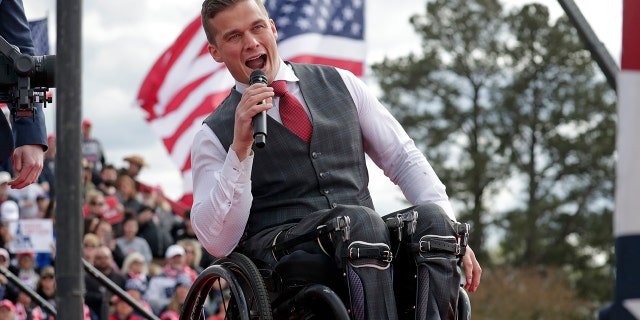 Rep. Madison Cawthorn speaks before former President Donald Trump takes the stage at a rally on April 9, 2022, in Selma, North Carolina.