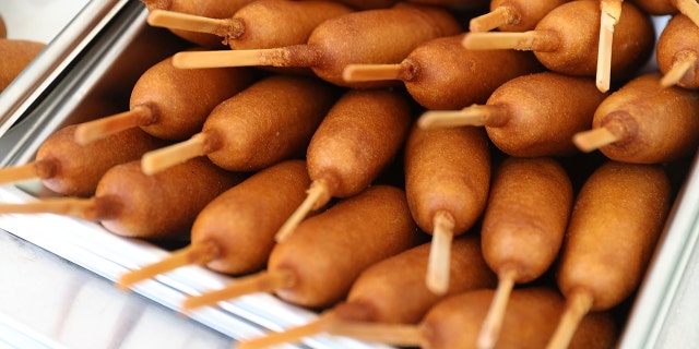 Corn dogs are ready to be eaten during the American Meat Institute's annual Hot Dog Lunch in the Rayburn courtyard on July 19, 2017, in Washington, D.C. The hot dog lunch held during National Hot Dog month has been celebrated for decades in Washington.