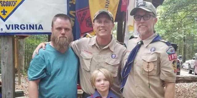 Brothers Jimmy (left) and Josh (center) Carter with Josh's young son.