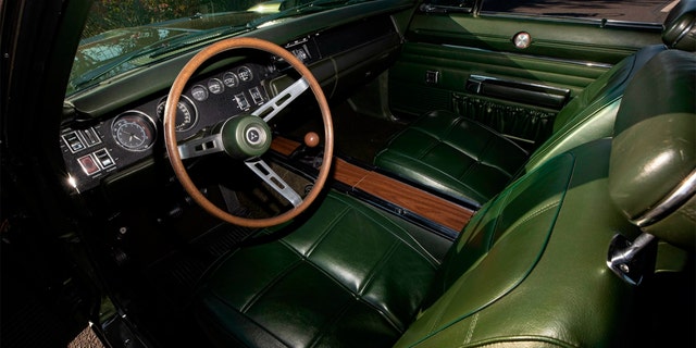 It is the only 1969 Hemi Daytona with a green vinyl bucket seat interior.