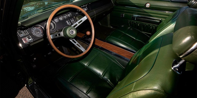 It is the only 1969 Hemi Daytona with a green vinyl bucket seat interior.