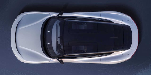 The Alpha5's gullwing doors have glass roof panels.