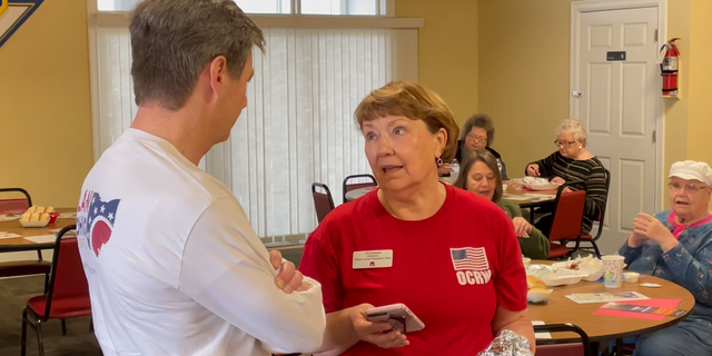 Ohio state Sen. Matt Dolan, who is running in the state's Senate GOP primary, speaks with a voter at an Ottawa Republican Women's Club event in Port Clinton, Ohio. (Tyler Olson/Fox News)