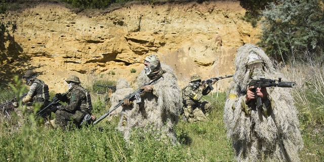 Ukrainian Territorial Defence Forces members train on the outskirts of Odesa, Ukraine, on Tuesday, May 24.