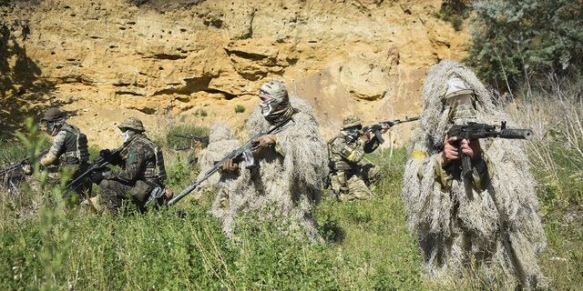 Ukrainian Territorial Defence Forces members train on the outskirts of Odesa, Ukraine, on Tuesday, May 24.