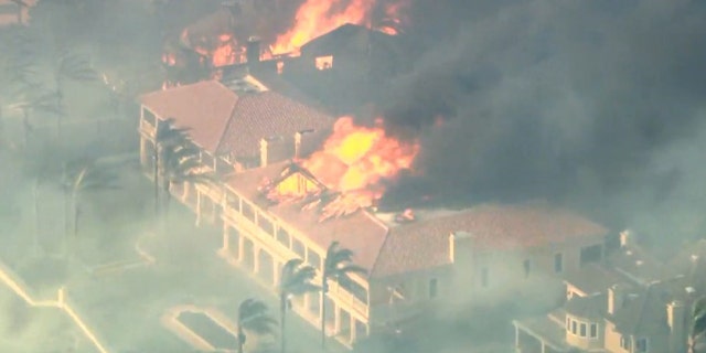 A million-dollar mansion is engulfed in flames in Orange County, 캘리포니아.