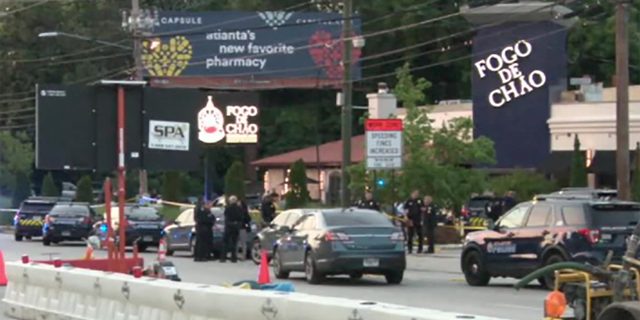 A large police presence outside the scene of an officer involved shooting at the Fogo de Chao steakhouse in Atlanta