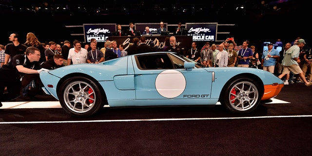 A different 2006 Ford GT Heritage Edition is auctioned at a Barrett-Jackson in 2016. 