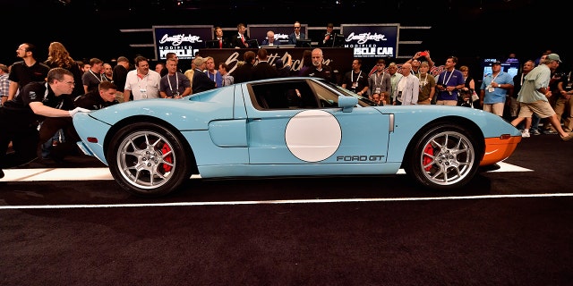 A different 2006 Ford GT Heritage Edition is auctioned at a Barrett-Jackson in 2016.