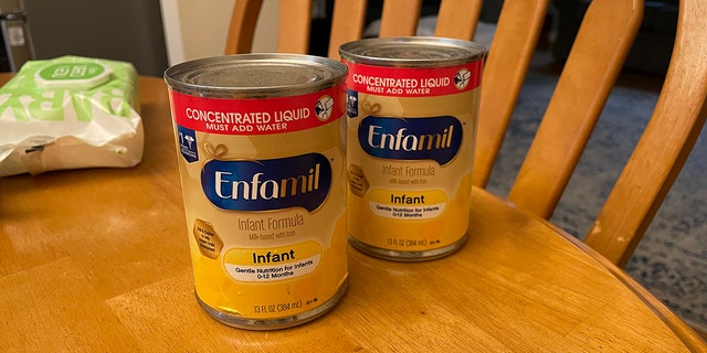 Two cans of baby formula are shown here. An Akron-based pediatrician advised parents to call pediatricians' offices with baby formula questions. 