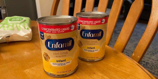 Two cans of baby formula are shown here. An Akron-based pediatrician advised parents to call pediatricians' offices with baby formula questions. 